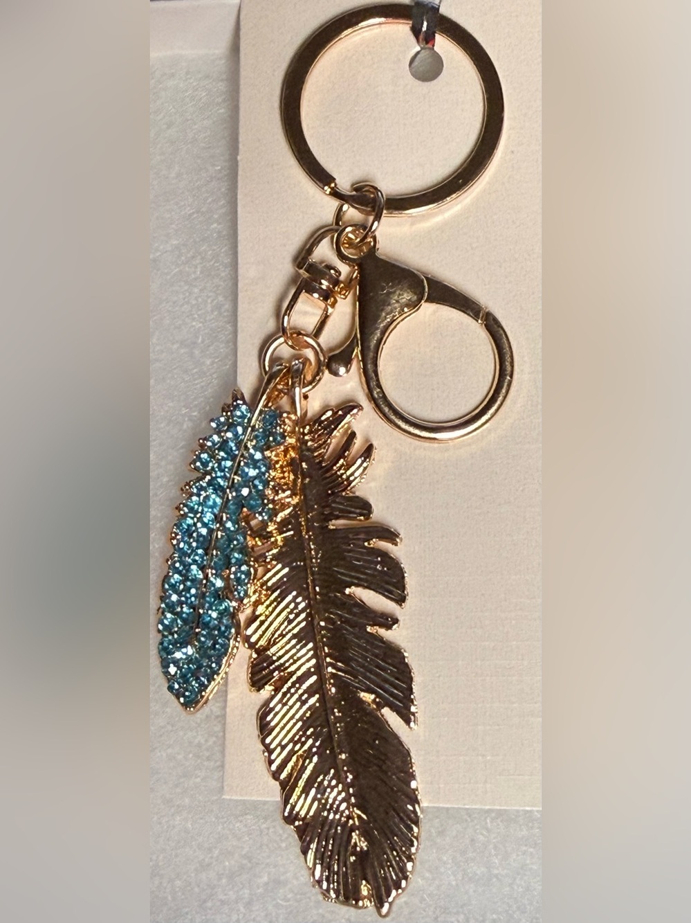 Gold Feather Keychain with Blue Crystal Accent